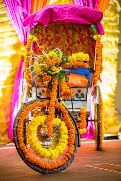 a bicycle decorated with orange and yellow flowers