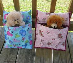 two stuffed animals are sitting in small bags on a porch bench, one is brown and the other is pink