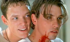 two young men with blood all over their face