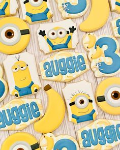 the cookies are decorated to look like minion characters and numbers for birthdays or baby showers