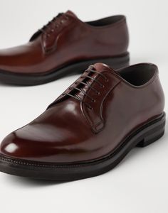 Cordovan Derbys Exquisite and timeless cordovan leather renews an iconic men's formal footwear design. Slight nuances of color enrich the leather's polished, even texture, while the silhouette of the upper and the thickness of the outsole are balanced to update the shoe’s classic aesthetic with a modern touch, in true Brunello Cucinelli style. Luxury Italian Leather Shoes For Formal Occasions, Classic Italian Calf Leather Shoes, Classic Italian Leather Shoes, Luxury Brown Derby Shoes For Semi-formal, Timeless Italian Oxfords For Semi-formal Occasions, Timeless Brown Derby For Formal Occasions, Luxury Plain Toe Dress Shoes, Goodyear Welted, Luxury Plain Toe Dress Shoes With Goodyear Welted, Luxury Semi-formal Leather Shoes With Goodyear Welt