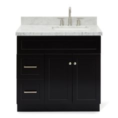 a bathroom vanity with marble top and drawers