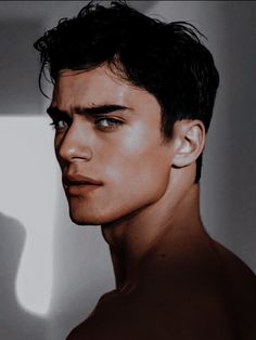 a young man with dark hair and no shirt on is staring at something in the distance