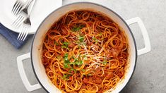 a pot filled with pasta and parmesan cheese