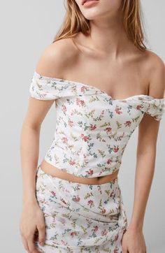 Sprays of colorful flowers and an off-the-shoulder design contribute to the beguiling romance of this pretty corset-inspired top Back zip closure Off-the-shoulder neck 100% polyester Machine wash, line dry Imported Feminine Off-shoulder Fitted Tube Top, Fitted Sleeveless Off-shoulder Top For Summer, Feminine Fitted Off-shoulder Tube Top, Fitted Feminine Off-shoulder Tube Top, Spring Off-shoulder Fitted Corset, Strapless Floral Print Corset For Spring, Fitted Off-shoulder Crop Top For Spring, Strapless Floral Corset For Spring, Chic Floral Print Spring Corset