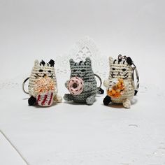 three small crocheted animals sitting next to each other