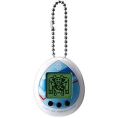 an alarm clock is hanging from a ball chain on a white background, it appears to be in the shape of a pacman