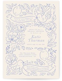 a white and blue wedding card with flowers, birds and leaves on it's border