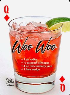 a glass filled with red liquid next to a lime wedge and the words who woo on it