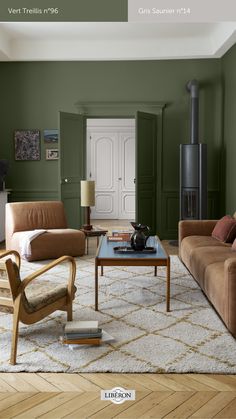 a living room with green walls and furniture