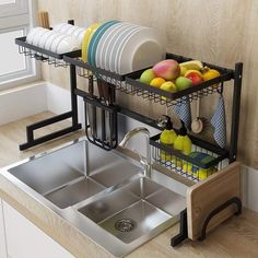 the kitchen sink is filled with dishes and utensils