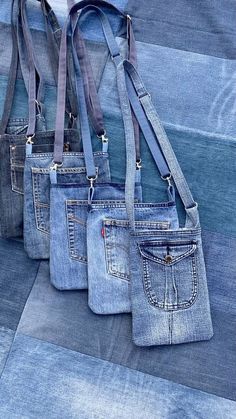 three denim purses sitting on top of each other