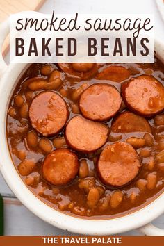 a bowl filled with baked beans and sausage