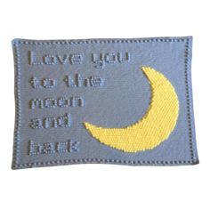 a blue and yellow patch with the words love you to the moon and back on it