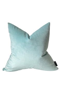 a light blue pillow on a white background