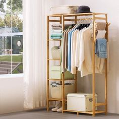 Our Cabinet Clothes Rack designed with 6-tier storage shelves, large clothes hanging area and additional side hanging rods. Select healthy bamboo and fine workmanship, stable rectangular structure with large bearing capacity which is sturdy and strong for daily use. Whether you’ve got limited space or are looking for an innovative clothing storage solution, this garment rack is here to help! Rebrilliant | Rebrilliant Ophilia 34.3 Adjustable, Bamboo | 20" L | Wayfair | Organization Shelves In Bedroom For Clothes Wood, Studio Apartment Wardrobe Storage, Open Wardrobe Shelf, Airbnb Clothes Storage, Wooden Shelf Clothes, Racks And Shelves For Bedroom, Clothes Basket In Bedroom, Clothes Rack Design, Shelves Clothes