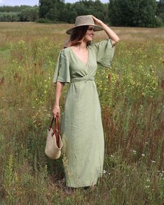 A linen maxi dress, featuring a plunging V-neck and elegant draped front. Elbow-length subtle ruffled sleeves and adjustable front cross belt offer a custom fit, while side slits add a graceful flow. Perfect for making a grand statement. With ruffled sleeves for a touch of romance, our white option is perfect as a linen wedding dress. This listing is for a “Made-to-order″ item which means that the item is made only after an order is placed. Order fulfillment can take up to 10 business days. The Wrap Dress Wedding, Maxi Linen Dress, Linen Dresses For Women, Linen Wedding Dress, Wedding Dress Elegant, Cross Belt, Linen Wedding, Linen Wrap Dress, Elegant Drapes