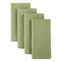 four green napkins are lined up on a white surface