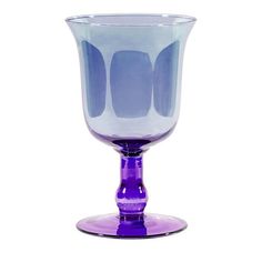 a purple glass vase sitting on top of a table