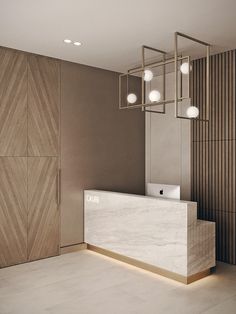 an empty reception area in a modern building with wood paneling on the walls and floor