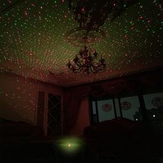 a living room filled with lots of lights and a chandelier