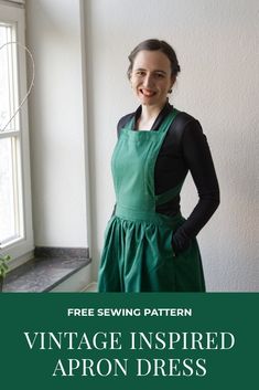 a woman standing in front of a window with the words vintage inspired apron dress on it