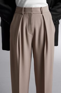 A tapered cut and front pleats define these polished yet casual pants that easily transition from the workplace to a dinner date. Zip fly with hook-and-bar closure Front slant pockets; back welt pockets 52% polyester, 48% viscose Dry clean Imported Tan Pants Outfit, Minimal Classic Style, Black Velvet Leggings, Slacks For Women, Workwear Trousers, Trouser Outfits, Tan Pants, Checked Trousers, Wide Trousers