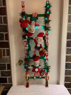 an elf shelf is decorated with christmas decorations