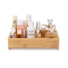 a wooden tray filled with different types of perfumes