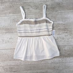 Nwt Old Navy Smocked Babydoll Tank Top White Medium 100% Cotton Sleeveless Size - Medium Color - White Material - 100% Cotton Condition - New With Tag Attached! Measurements - *Please See Pictures* Features: Babydoll Tank Top, Pullover, Sleeveless, Square Neck, Ruffle, Smocked, Stretch Aesthetic: Casual, Classic, Summer, Vacation, Travel ** All Measurements Are Approximate Sleeveless Smocked Top With Ruffles For Beach, Summer Cotton Tank Top With Smocked Back, Beach Cotton Tank Top With Smocked Back, Cotton Tank Top With Smocked Back For Beach, Beach Cami Tank Top With Smocked Bodice, Beach Smocked Cami Top, Cami Tank Top With Smocked Bodice For Beach, Summer Sleeveless Camisole With Smocked Bodice, Beach Cami Top With Smocked Bodice