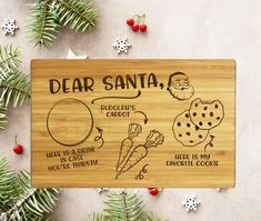 a wooden cutting board with the words dear santa on it