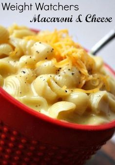 a red bowl filled with macaroni and cheese