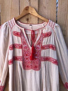 Free People Hungarian Embroidered Peasant Blouse  I ♥️ this blouse and I wish this fit me so bad. It's marked an XS but as you know Free People runs super big so this can fit up to a size 10 it should be loose fitting and the embroidery is perfectly intact.  So much detail. And excellent condition.   WE CAN BUNDLE MULTIPLE ITEMS FOR LOWER SHIPPING ~ Just message me to arrange  Great gently used condition + no known flaws or wear *All my gently used items come freshly washed and ready to wear We Traditional Embroidered V-neck Peasant Top, Spring Tunic Top With Intricate Embroidery, Summer Peasant Tops With Embroidered Sleeves, Peasant Tops With Embroidered Sleeves For Summer, Peasant Blouse With Embroidered Neckline For Festival, Peasant Tops With Embroidered Sleeves For Festivals, Bohemian Red Blouse With Intricate Embroidery, Summer Festival Peasant Top With Embroidered Sleeves, Peasant Top With Embroidered Sleeves For Festival