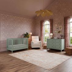 a living room filled with furniture and a baby crib in front of two windows