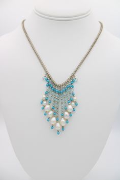 This beautiful vintage bib necklace has genuine White Pearls with Crystal, Sterling Silver and turquoise beads. This necklace is really pretty and unusual, the pearl tassels run in a graduated size. The necklace is just over 17 inches in length. Signed 925 on the dolphin shaped clasp. Please see photos for approximate measurements and further details. NOTE: Items in photographs may appear larger or smaller than actual size. Please make sure to check the item descriptions and all photographs care Elegant Beaded Dangle Turquoise Necklace, Pearl Tassels, Pearl Bib Necklace, Sunset Beach, Bib Necklace, Agate Gemstone, Turquoise Beads, White Pearl, Art Deco Fashion