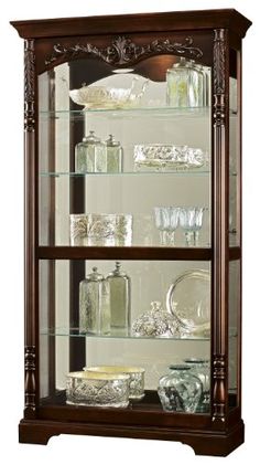 a wooden display case with glass shelves