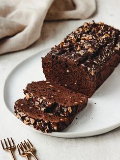 two slices of chocolate cake on a white plate