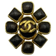 Chanel brooch from the 1997 gold plated. In wonderful vintage condition, with a large CC in the center and a plethora of round and square shapes surrounding it. Signed Chanel on the reverse. Made in France . Broche Chanel, Chanel Jewellery, Chanel Brooch, Chanel Couture, Chanel Vintage, Chanel Jewelry, Vintage Chanel, Angelina Jolie, Made In France