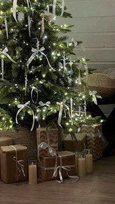 a christmas tree with presents under it