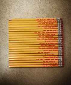 several yellow pencils lined up on top of each other