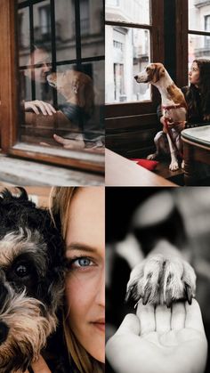 a woman holding a dog in front of a window