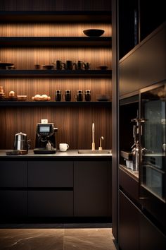 a kitchen with dark cabinets and wooden shelves