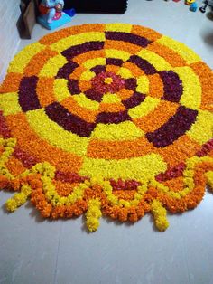 a large circular flower arrangement on the floor