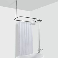 a bathroom with a tub, shower head and hand rail in it's corner