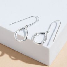 Made with genuine 925 Sterling Silver Nickel-free and lead-free Hypoallergenic and antimicrobial Boma 925 hallmark is located on the inner side of the ear wire. Code : EDA 2717 Dimensions : approx. 1/8" depth x 1/2" width x 1 1/8" height Wild textured organic teardrop hoops that speak volumes. We are all ears. Whether you're looking for a unique pair of everyday earrings or something extra special to layer with your favorite pieces, our drop down earrings are perfect to complete your look and co Metal Cart, Silver And Gold Jewelry, Everyday Earrings, Seattle Washington, Jewelry Companies, Love Symbols, Ear Wire, Ring Bracelet, Earring Necklace