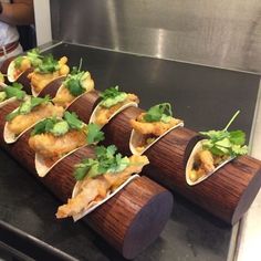 some food is laying out on a wooden board and ready to be cooked in the oven