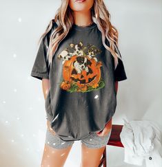 Vintage 90s Dog Halloween Shirt ⭐ Welcome to K & K Custom Tees! ⭐  - Indulge in pure comfort with our Comfort Colors Shirt. Soft, relaxed, and available in a variety of colors! ⭐SHIRT DETAILS⭐  -High Quality fabric  -100% ring-spun US cotton -Designed and printed in the USA  ⭐ PLEASE NOTE ⭐ -For an oversized look, we suggest to size up 1-2 sizes. These shirts run like standard unisex tees. Please see size chart for a more fitted look!  -Colors may vary based on your monitor or screen display! ⭐CARE INSTRUCTIONS ⭐ -Machine wash inside out in cold water  -Tumble dry medium or hang to dry  -Do not dry clean or iron directly onto the design  ⭐PROCESSING & SHIPPING TIMES ⭐ -Processing time: 3 to 5 business days  -Shipping time: US - 2 to 5 business days  ⭐OUR GOAL⭐  -Delivering top-notch t-shir 90s Crew Neck Halloween Tops, 90s Style Halloween Graphic Print Top, 90s Halloween Graphic Print Top, 90s Graphic Print Top For Halloween, Vintage Halloween Character Print Top, Vintage Halloween Tops With Character Print, 90s Style Halloween Tops, K K, Comfort Colors Shirt