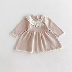 Indulge in luxury with our Scalloped Knit Dress. The long sleeves and delicate scalloped trim add an elegant touch, while the button closure in the back ensures a perfect fit for your little one. A must-have for any baby girl's wardrobe. Cute Long Sleeve Sweater Dress For Fall, Fitted Long Sleeve Dress With Crochet Trim, Fitted Long Sleeve Dress With Scalloped Edges, Cream Long Sleeve Dress With Lace Collar, Elegant Long Sleeve Dress With Crochet Trim, Pink Lace Trim Dress For Fall, Elegant Pink Long Sleeve Sweater Dress, Long Sleeve Dress With Lace Collar For Fall, Cute Cream Winter Dress