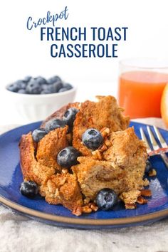 blueberry french toast casserole on a plate with a fork and glass of orange juice