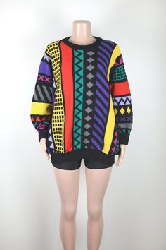 This 80s Jumper is a hand knit one of a kind.  It is made from Australian Merino Wool, is crazy colourful, bright, eye catching and super soft and warm.  Perfect for adding a bit of something extra to any Winter look. Brand: Handmade.  Fabric: Rainbow Merino Wool Colour: Black and Rainbow.  Brand: Anchor Blue. Size & Measurements: This jumper is a size 16 Australian Womens, and also looks incredible when worn over-sized. Retro Knitted Acrylic Sweater, Vintage Hand Knitted Crew Neck Sweater, Retro Multicolor Knit Sweater, Retro Multicolor Acrylic Sweater, Vintage Multicolor Knitted Sweater, Vintage Multicolor Acrylic Sweater, Vintage Multicolor Knit Sweater, Vintage Multicolor Jacquard Knit Sweater, Retro Knit Sweater